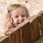 photo credit: tbeckeryvr young child laughs at wood fence via photopin (license)